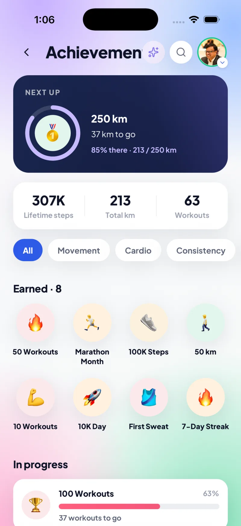 Achievements screen with lifetime steps, distance, workouts and earned badges